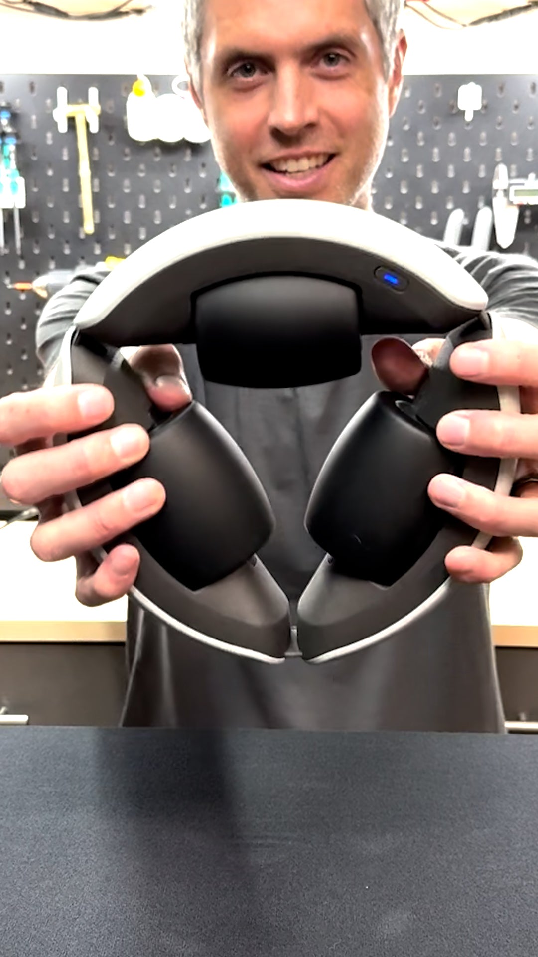 Founder video poster - Aaron holding Therabot
