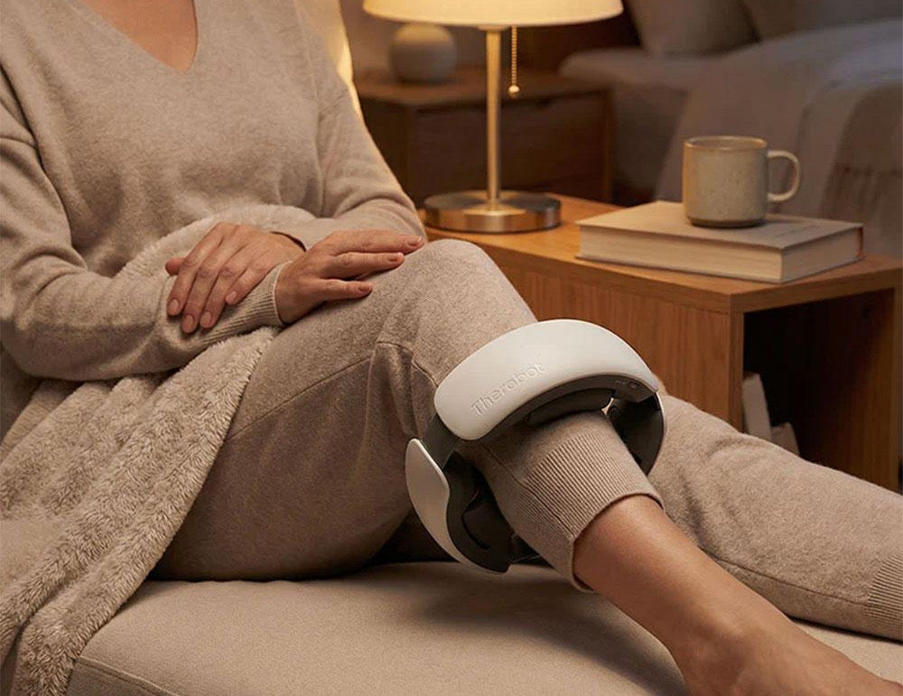 Woman relaxing in bed using Therabot
